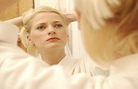 Looking in mirror